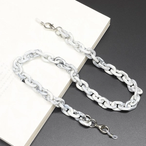 Detail of marble pattern acrylic eyewear chain with silver lobster clasps and silicone loops