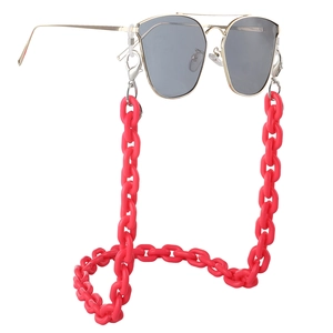 Red acrylic eyewear chain with thick link design and silver lobster clasps on sunglasses