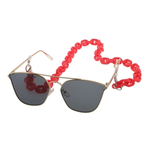 Detail of red acrylic chunky chain lanyard attached to gold metal sunglasses frame