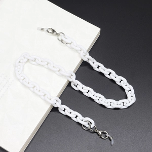 Detail of white chunky acrylic glasses chain with silver lobster clasps and silicone loops