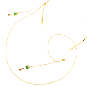 Golden eyewear chain featuring tropical palm tree pendants with green enamel leaves