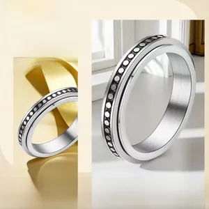 Detailed close-up of a 6mm stainless steel spinner ring with a smooth rotating outer band