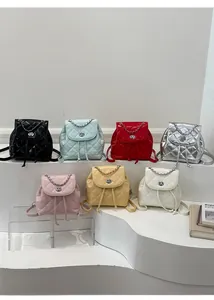 Multiple colors of quilted mini backpacks with chain handles and turn-lock closures