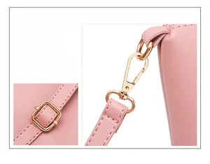 Detail of pink Saffiano leather texture and shiny golden metal hardware on crossbody bag