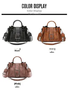 Three bucket bags in black, brown and pink with metal buckles and striped straps
