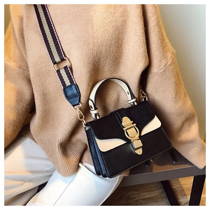 Fashionable bicolor shoulder bag for women with gold clasp and striped wide strap