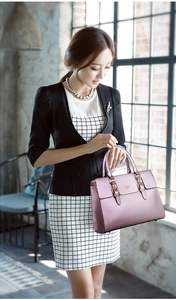 Elegant deep purple business tote bag with gold logo shown held by a model