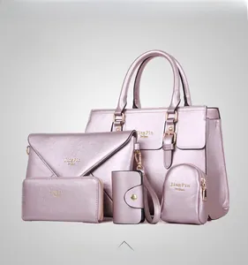 Detailed five-piece set of metallic pink faux leather handbags with crossgrain texture