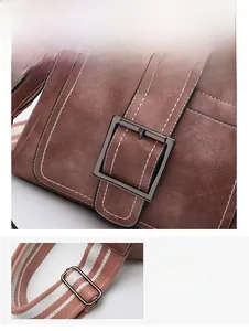 Close-up of retro metal belt buckle and striped fabric shoulder strap on a bucket bag