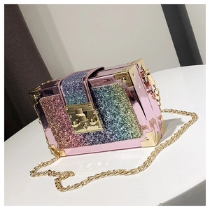 Close-up of pink mirror metal box bag with gradient sequins and golden push lock