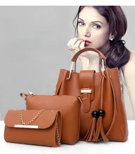 Three-piece brown PU leather handbag set including tote with tassel, crossbody and clutch