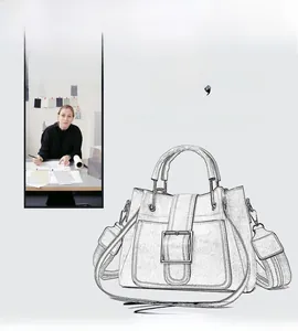 Classic bucket bag design sketch with metal buckle detail and wide shoulder strap