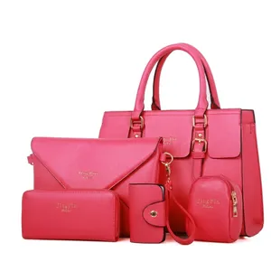 Five-piece rose red faux leather handbag set with tote, clutch and matching wallets