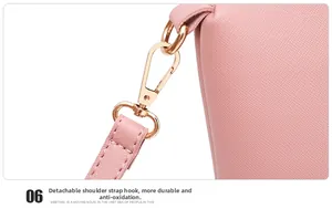 Detail of durable pink textured leather bag with anti-oxidation gold metal strap hooks
