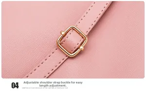 Detail of adjustable gold buckle on pink Saffiano leather shoulder strap