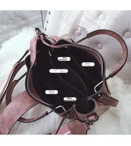 Top view of bucket bag interior featuring multiple compartments and zip pockets