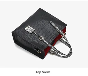 Top view of black crocodile pattern tote bag with snake skin straps and red interior