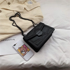 Retro black crossbody chain bag with geometric studs and metallic buckle closure