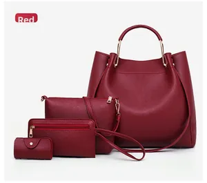 Detail of red 4-piece handbag set with tote and cross-body bag in cross-grain leather