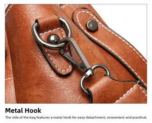 Detail of durable hardware hook and premium oil wax leather texture on a brown bucket bag