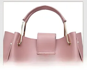 Detail of pink PU leather handbag showing high-quality stitching and metal ring handle