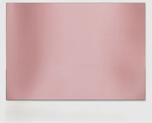 Close-up of premium pink synthetic leather texture with fine grain on a stylish handbag