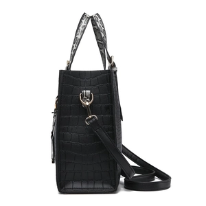 Black crocodile embossed tote bag with snake skin pattern handles and gold tone hardware