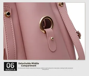 Detail of light pink PU leather bag with golden ring hardware and detachable inner pouch
