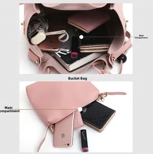 Internal view of pink bucket bag showing a large main compartment with various daily items
