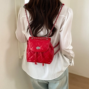 Stylish red quilted mini backpack for women with metal chain straps and silver twist lock