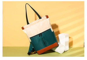 Three-color nylon backpack showing waterproof material and faux leather base detail