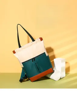 Detailed view of tricolor waterproof nylon bag with versatile 3-way carrying straps