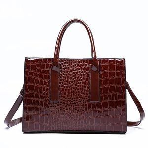 Elegant mahogany crocodile pattern tote bag with polished finish and gold hardware