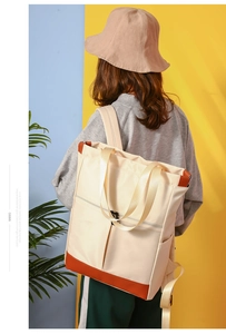 Waterproof nylon convertible tote bag shown as a backpack in a lifestyle outdoor setting