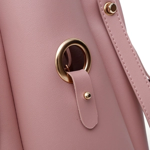 Pink faux leather handbag with golden eyelet detail and stitching on the side