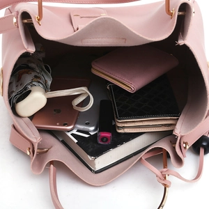 Pink faux leather bucket bag showing large interior capacity for daily essentials