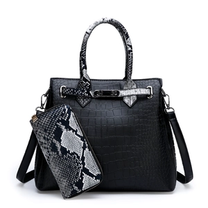 Elegant black crocodile-embossed tote bag set with snakeskin pattern wallet on white background