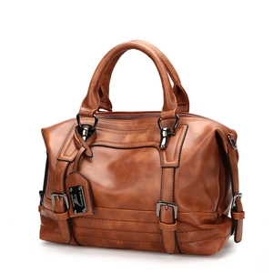 Vintage brown leather Boston handbag with retro soft texture and metal hardware