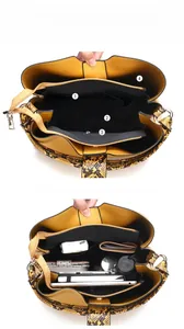 Large capacity yellow snakeskin tote bag showing internal compartments for iPad and storage