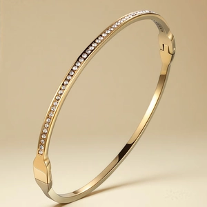 Detailed view of gold plated bangle showing cubic zirconia micro-pave and side clasp