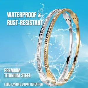 Micro-paved zirconia stainless steel hinged bangles in gold and silver finish