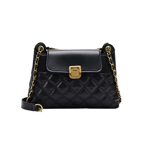 Quilted black leather crossbody bag with gold chain strap and square metal lock closure