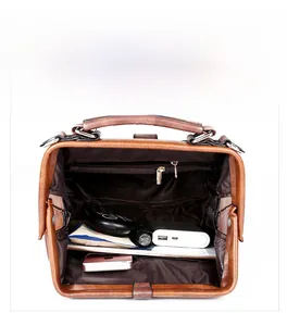 Interior view of vintage doctor bag showing spacious pockets and metal frame closure