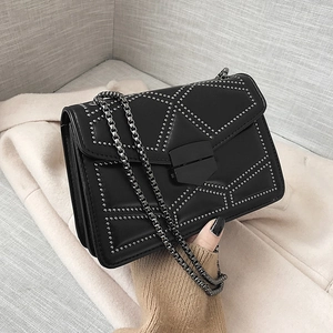 Fashionable black leather crossbody bag with silver rivet patterns and metal chain strap