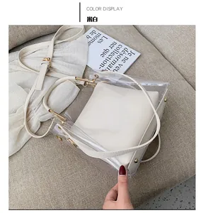 Top-down view of clear PVC jelly tote bag with a beige inner pouch on a soft fabric sofa