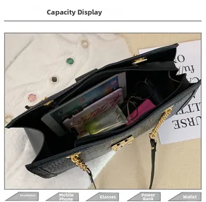 Top view of large black crocodile pattern tote bag showing spacious inner storage capacity