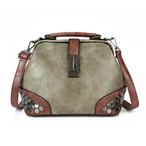 Retro army green doctor bag with rivets and contrast brown leather straps