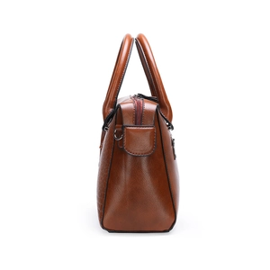 Classic caramel brown crocodile embossed tote bag with dual handles and side metal details