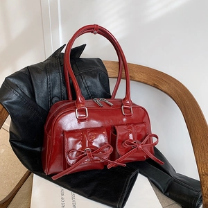 Deep red patent leather shoulder bag with chic bow details and large capacity for women