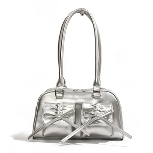 Metallic silver hobo bag with large bow accents and spacious twin pocket design